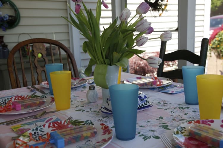 Table set on screened-in porch.