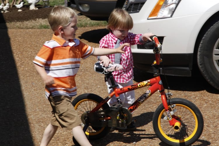 Levi giving bike tips to Elijah.